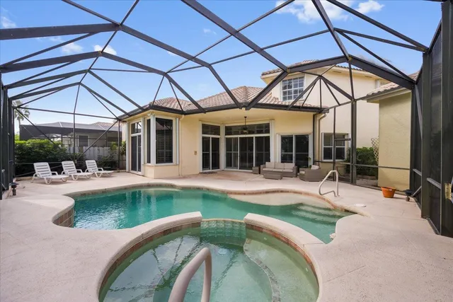 a view of a swimming pool with a patio