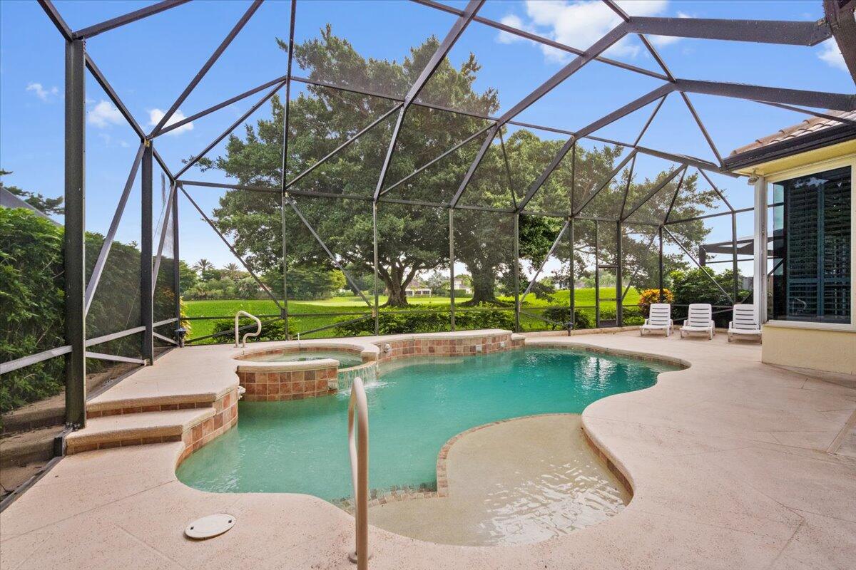 2514 Players Court Wellington, FL 33414 - Photo 28 of 30 a view of a swimming pool with a patio