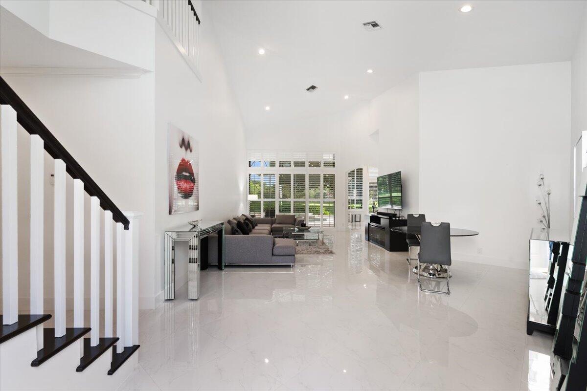 2514 Players Court Wellington, FL 33414 - Photo 3 of 30 a very nice looking room with a large window and couch