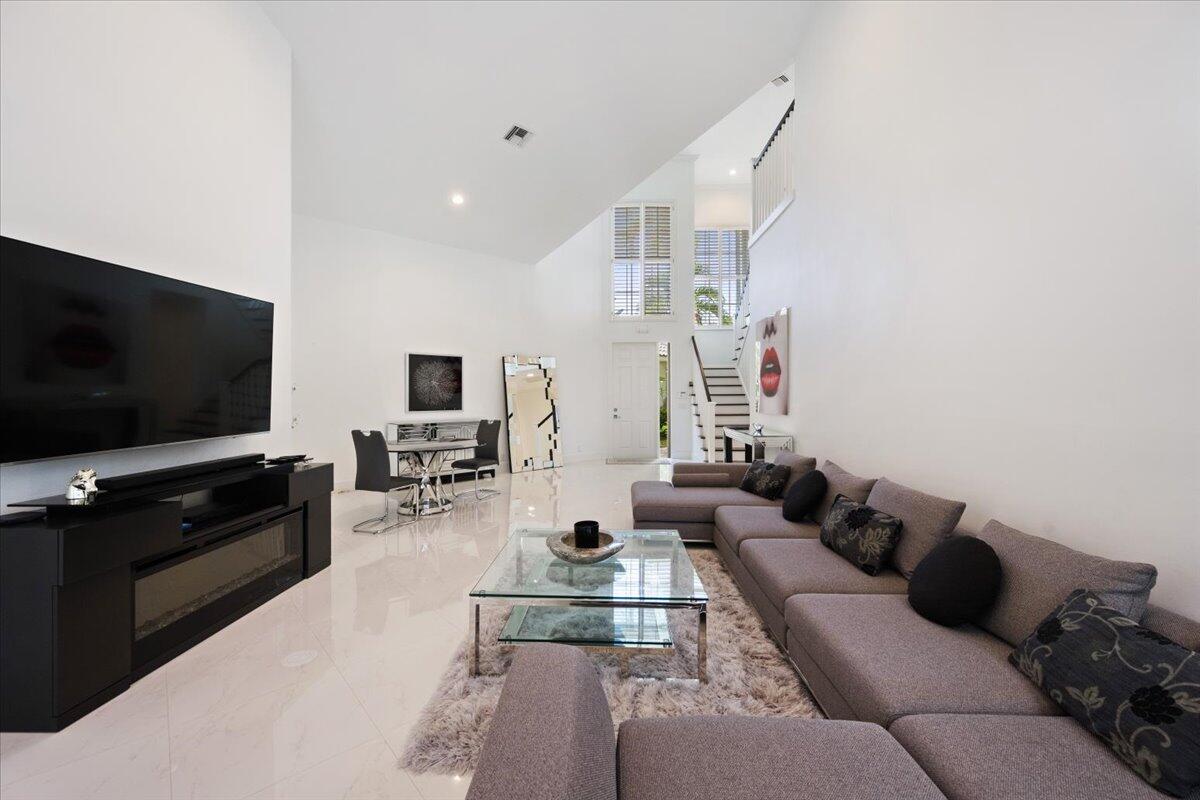 2514 Players Court Wellington, FL 33414 - Photo 6 of 30 a living room with furniture and a flat screen tv