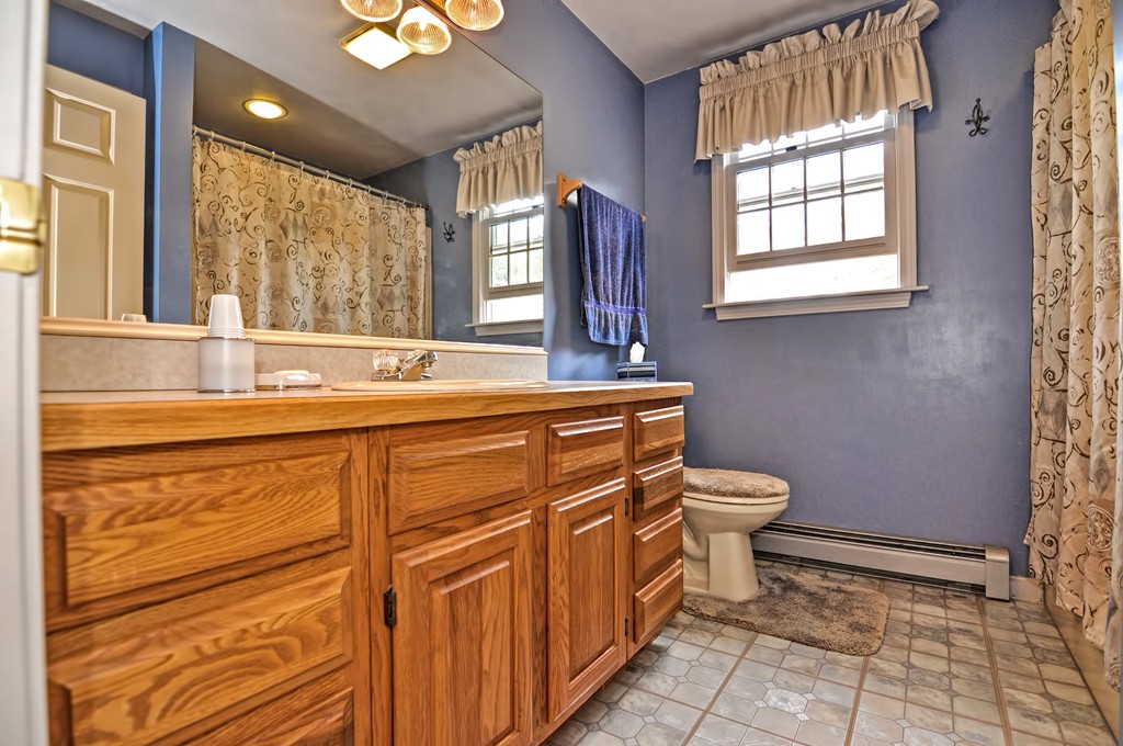 15 Dana Road Sandwich, MA 02644 - Photo 16 of 30 a bathroom with a sink a toilet and a mirror