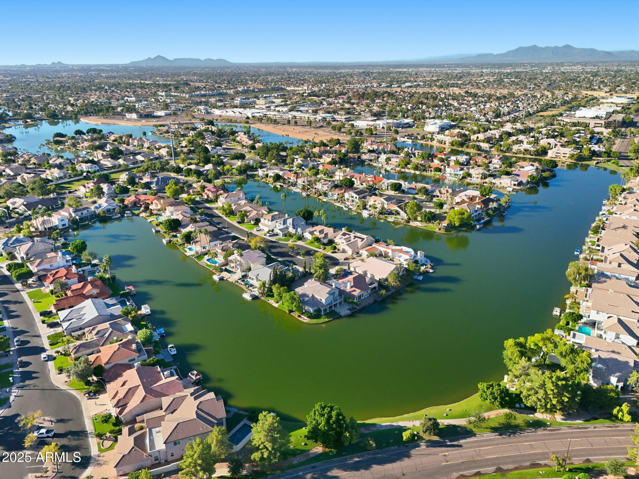 2011 East Clipper Lane Gilbert, AZ 85234 - Photo 11 of 51 an aerial view of a city with lots of residential buildings ocean and mountain view in back