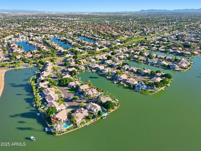 an aerial view of lake residential houses with outdoor space and lake view