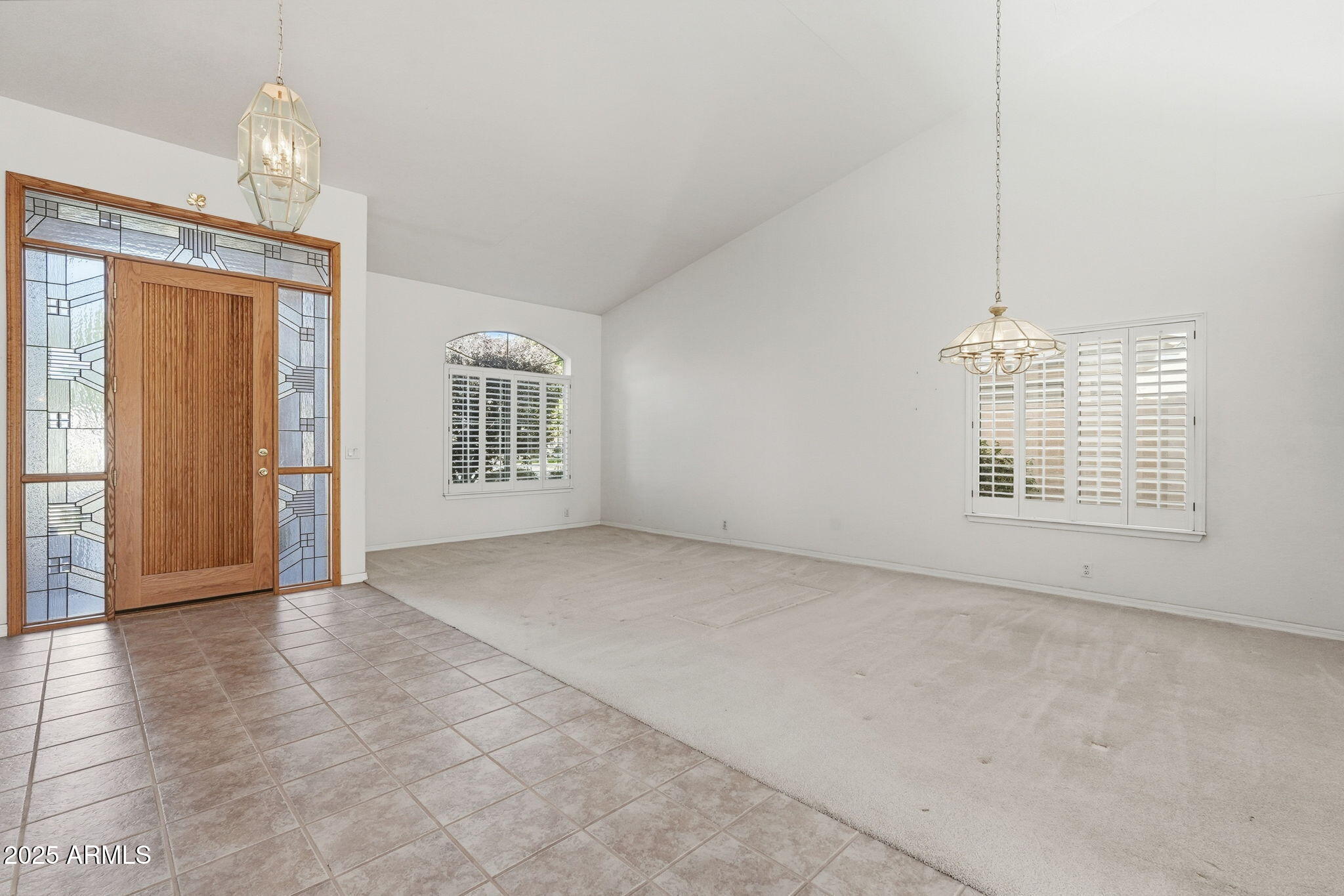 2011 East Clipper Lane Gilbert, AZ 85234 - Photo 19 of 51 an empty room with windows and chandelier