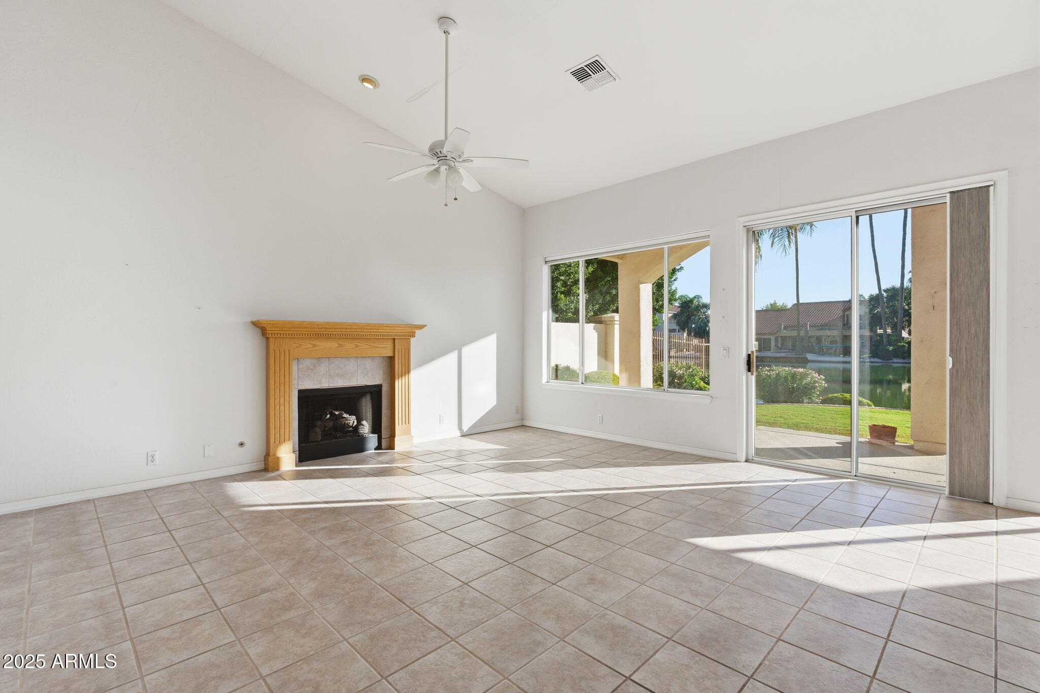 2011 East Clipper Lane Gilbert, AZ 85234 - Photo 23 of 51 a view of an empty room with a fireplace and a large window
