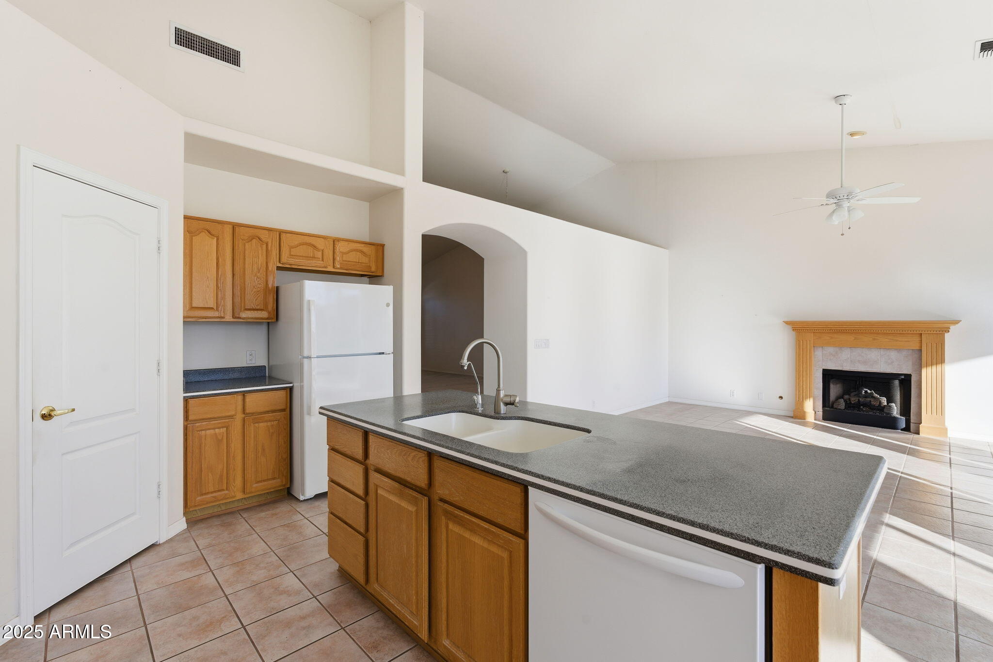2011 East Clipper Lane Gilbert, AZ 85234 - Photo 27 of 51 a kitchen with stainless steel appliances granite countertop a sink and a refrigerator