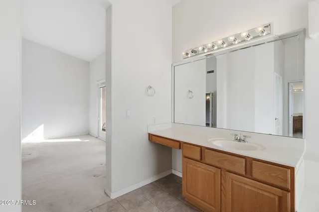 a bathroom with a sink and mirror