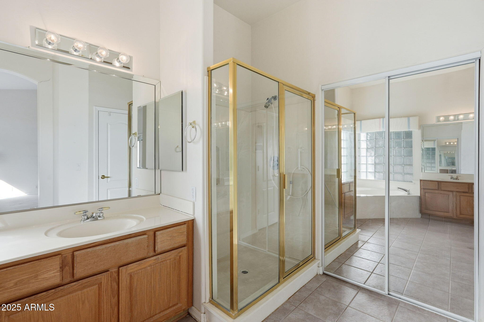 2011 East Clipper Lane Gilbert, AZ 85234 - Photo 33 of 51 a bathroom with a shower sink and mirror