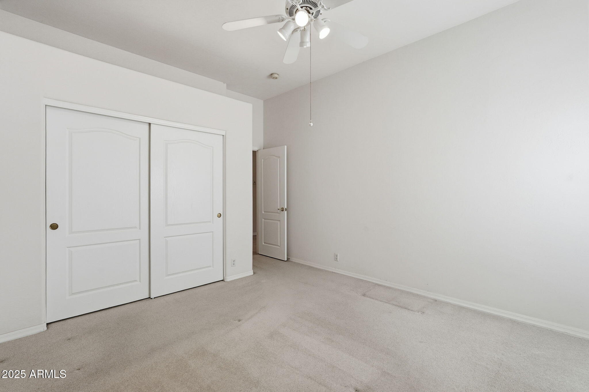 2011 East Clipper Lane Gilbert, AZ 85234 - Photo 35 of 51 an empty room with a ceiling fan and a window