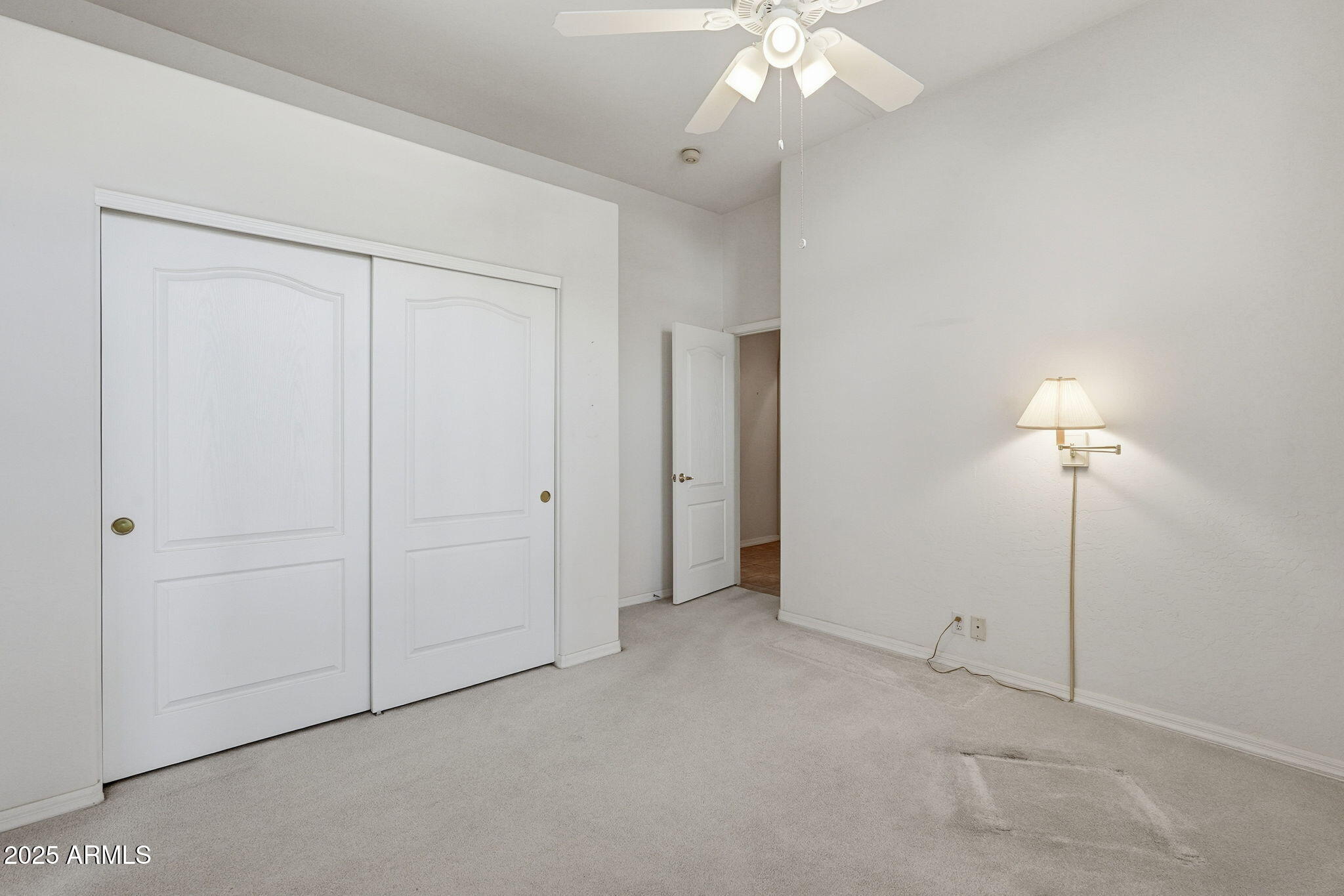 2011 East Clipper Lane Gilbert, AZ 85234 - Photo 36 of 51 an empty room with a chandelier fan