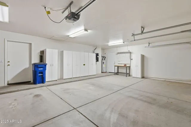 a view of a livingroom with a ceiling fan and window