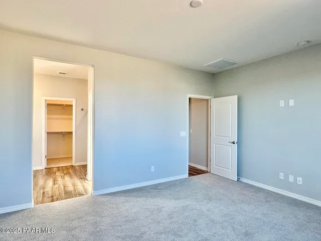 a bathroom with a double vanity sink and mirror