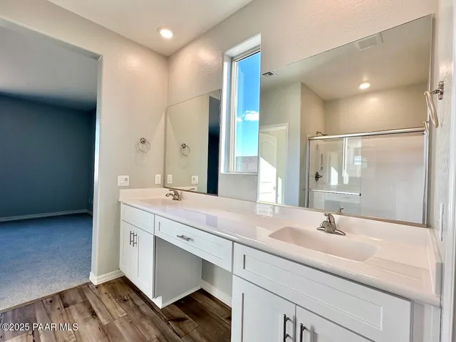 a bathroom view of a toilet and a shower