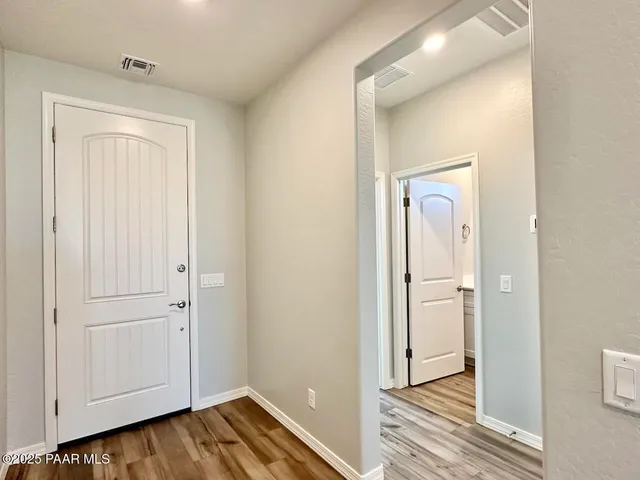 a view of a livingroom from a hallway