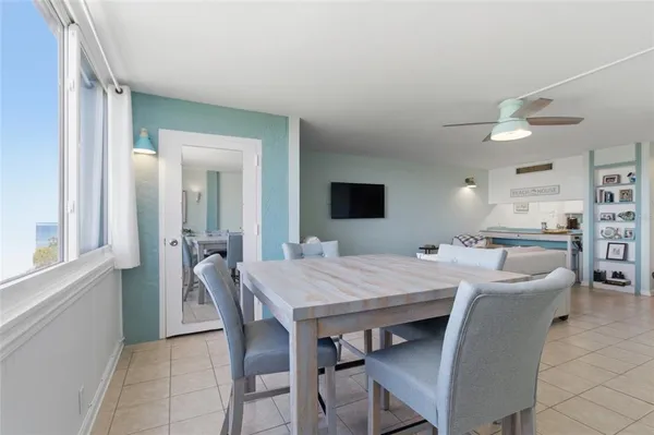 a dining room with furniture and window