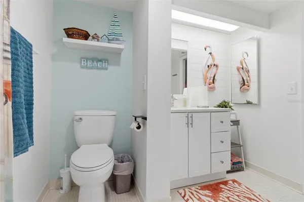 a bathroom with a toilet sink and shower