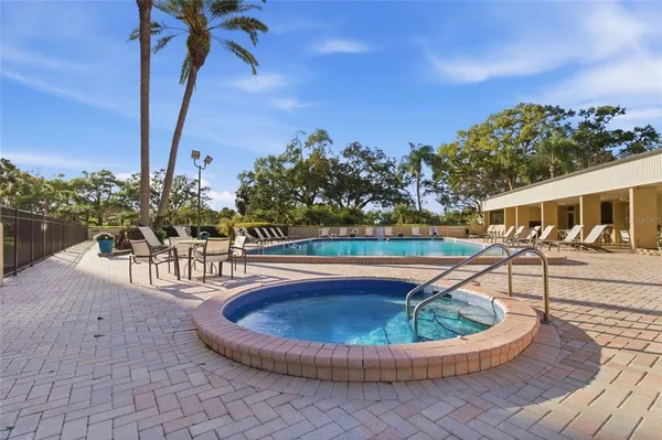 a view of a swimming pool with a porch