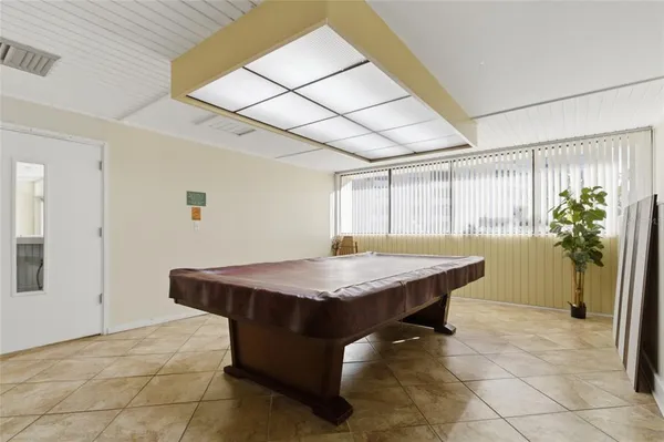 a view of a livingroom with furniture and windows