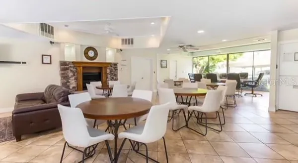 a view of a swimming pool with a table and chairs
