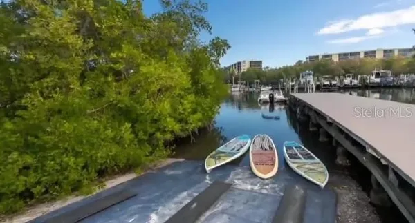 a view of a swimming pool with an outdoor seating and a yard