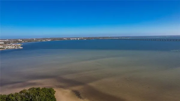 a view of a lake with a building in the background