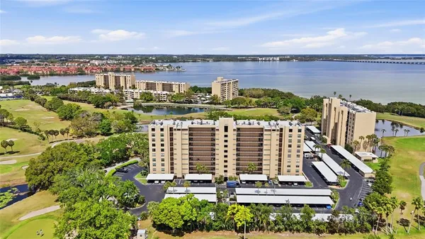 a view of a room that has a bed and a window
