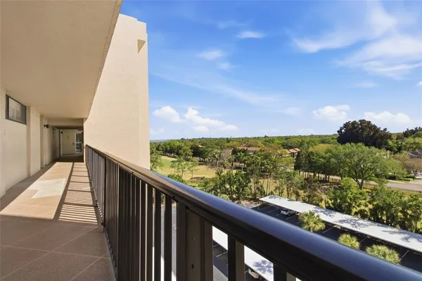 a view of balcony with furniture