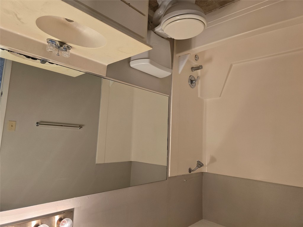 910 Duncan Lane, Unit 56 Austin, TX 78705 - Photo 11 of 13 a bathroom with a sink toilet and shower