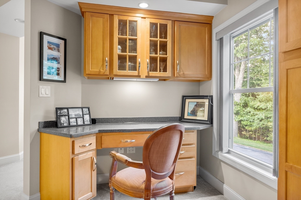 490 Main Street, Unit 215 Northborough, MA 01532 - Photo 16 of 37 a view of a room that has a bed and a chair