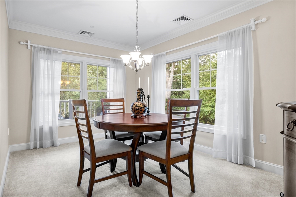 490 Main Street, Unit 215 Northborough, MA 01532 - Photo 18 of 37 a view of a dining room with furniture window and outside view