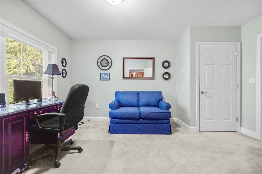 490 Main Street, Unit 215 Northborough, MA 01532 - Photo 26 of 37 a view of a livingroom with workspace and a window
