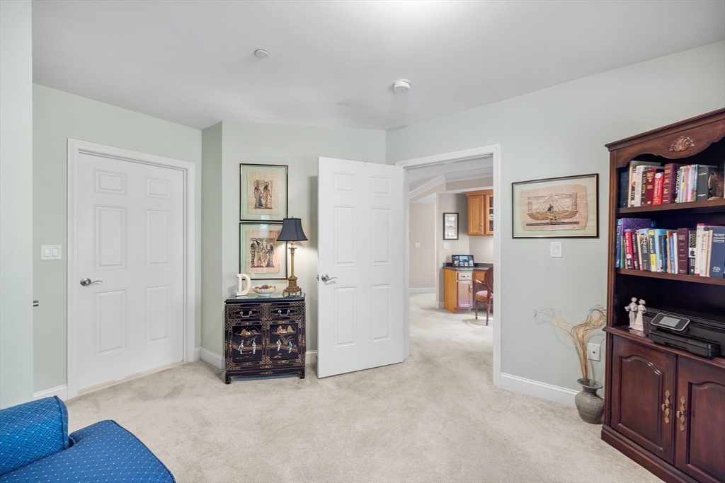490 Main Street, Unit 215 Northborough, MA 01532 - Photo 27 of 37 a view of a livingroom with furniture and cabinet