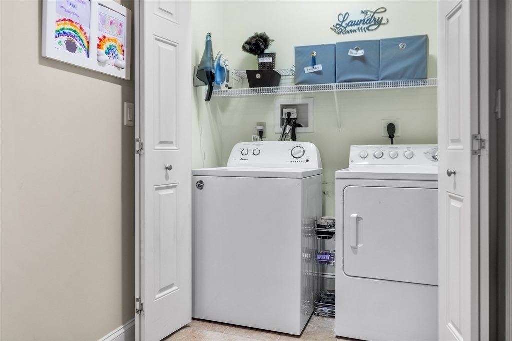 490 Main Street, Unit 215 Northborough, MA 01532 - Photo 30 of 37 a utility room with dryer and washer