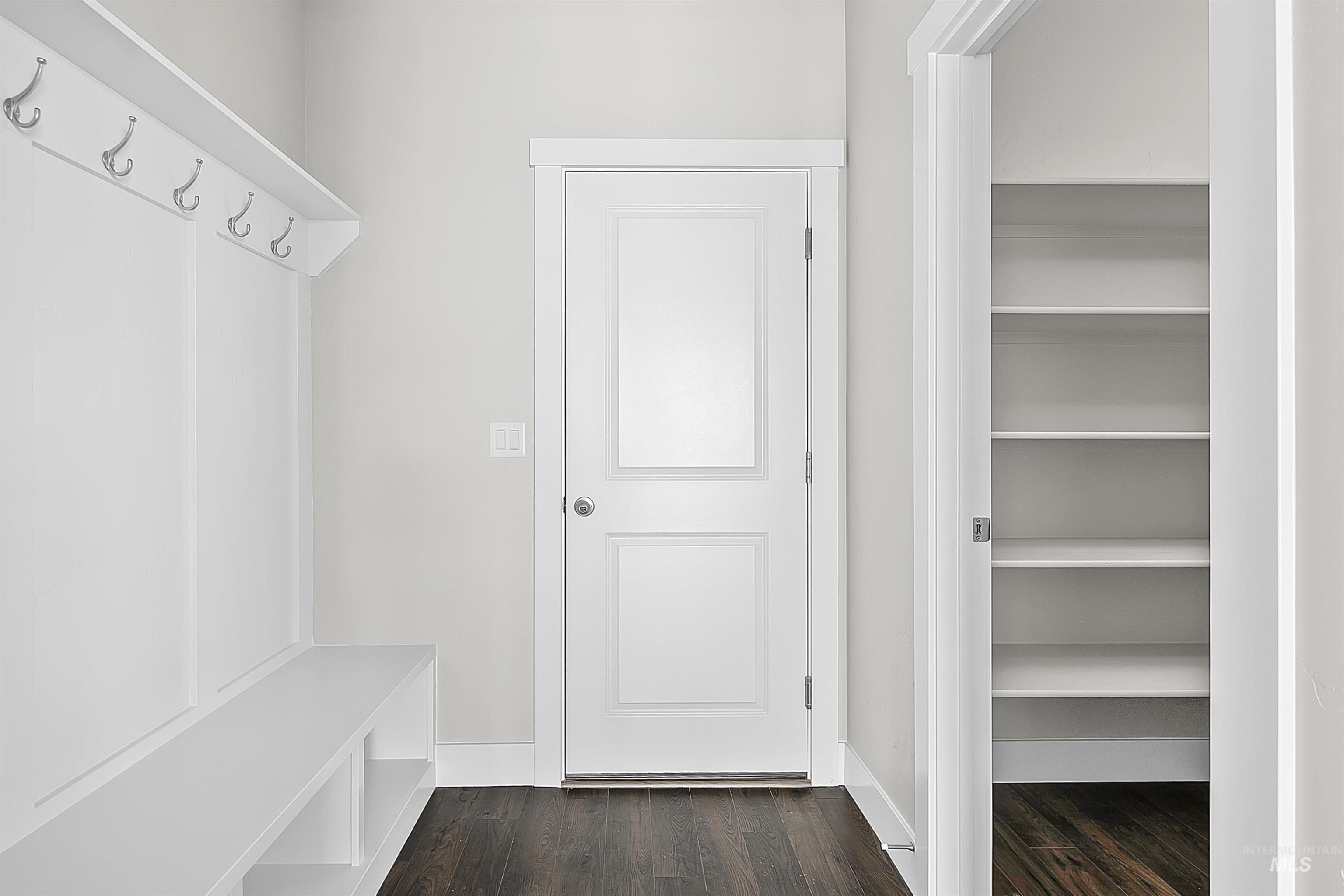 5985 North Backfire Way Meridian, ID 83646 - Photo 16 of 17 Mudroom with dark wood-style flooring and baseboards