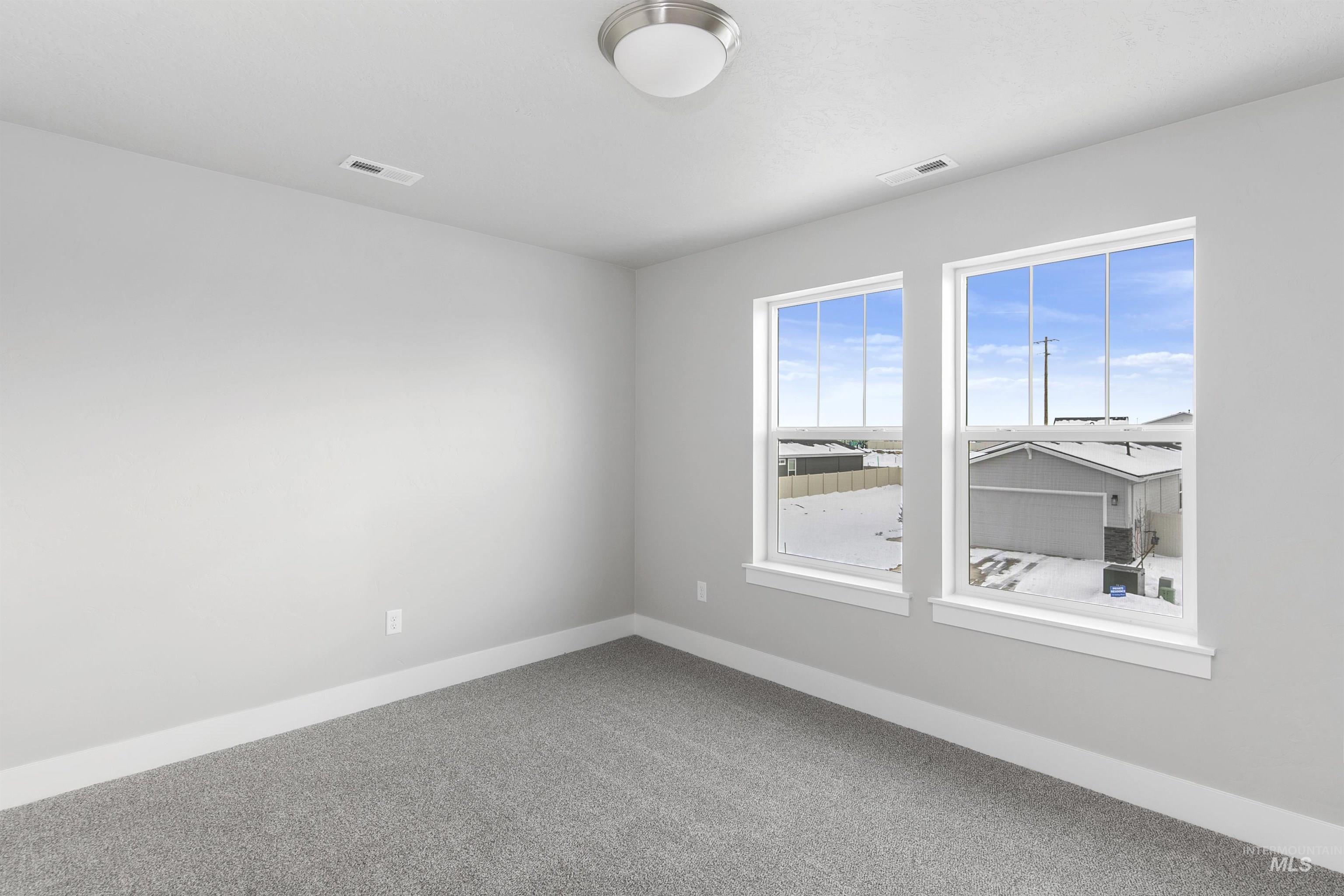 5985 North Backfire Way Meridian, ID 83646 - Photo 8 of 17 Empty room featuring baseboards and carpet flooring