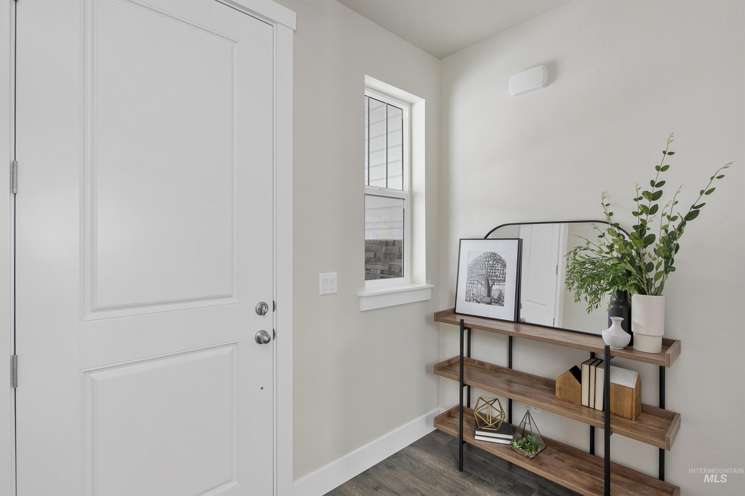 5985 North Backfire Way Meridian, ID 83646 - Photo 10 of 17 Foyer with baseboards and dark wood-style floors