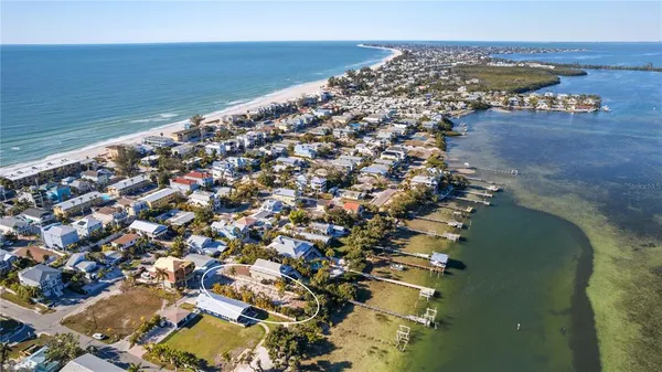 an aerial view of a house with a lake view