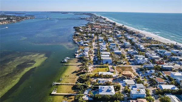an aerial view of a house with a lake view