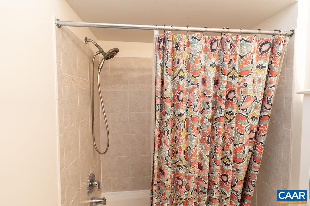 920 Bing Lane Charlottesville, VA 22903 - Photo 11 of 47 a bathroom with a shower curtain