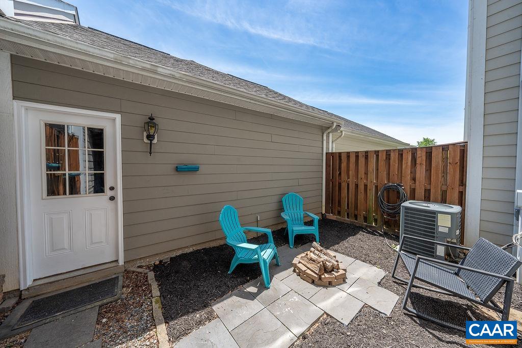 920 Bing Lane Charlottesville, VA 22903 - Photo 14 of 47 a backyard of a house with table and chairs