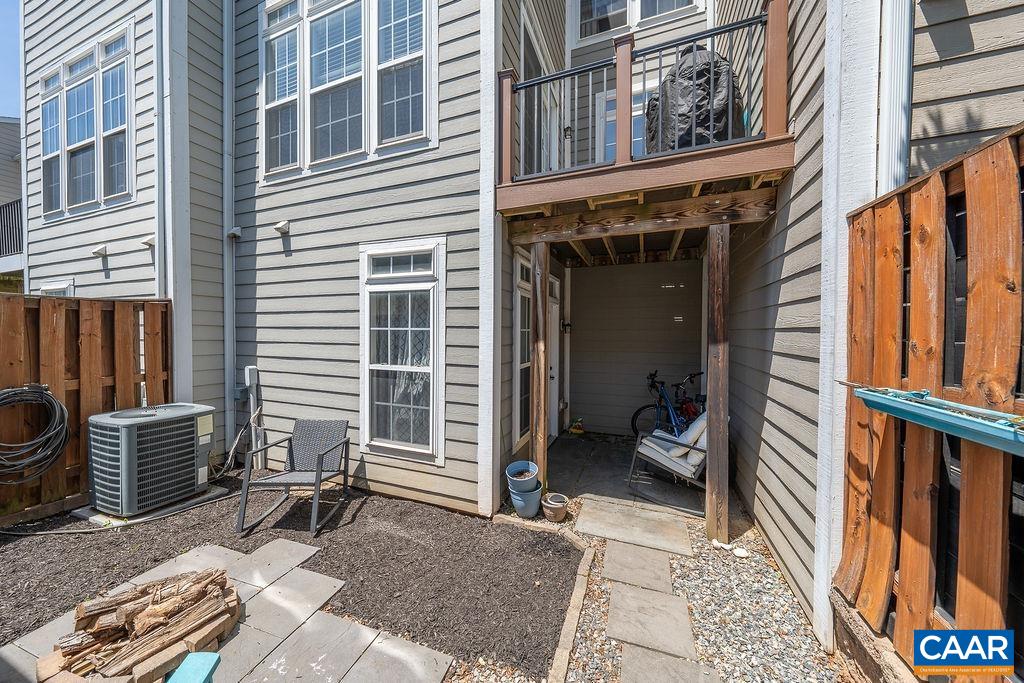 920 Bing Lane Charlottesville, VA 22903 - Photo 15 of 47 a view of a balcony with chair and wooden floor