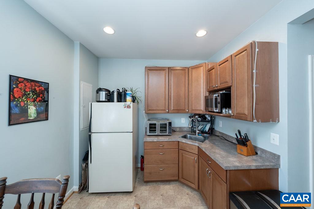 920 Bing Lane Charlottesville, VA 22903 - Photo 17 of 47 a kitchen with refrigerator cabinets and a sink