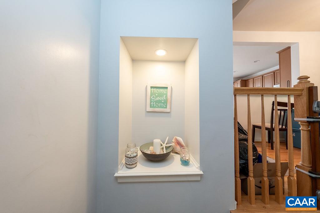 920 Bing Lane Charlottesville, VA 22903 - Photo 21 of 47 a view of a hallway with wooden floor and a dining room