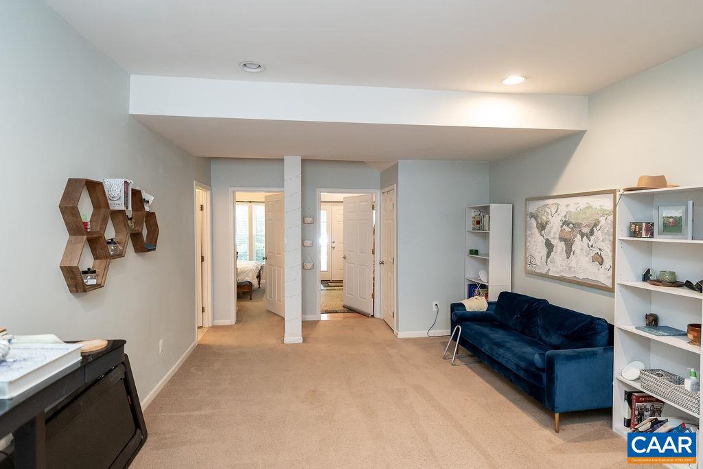920 Bing Lane Charlottesville, VA 22903 - Photo 4 of 47 a living room with a couch and gym equipment