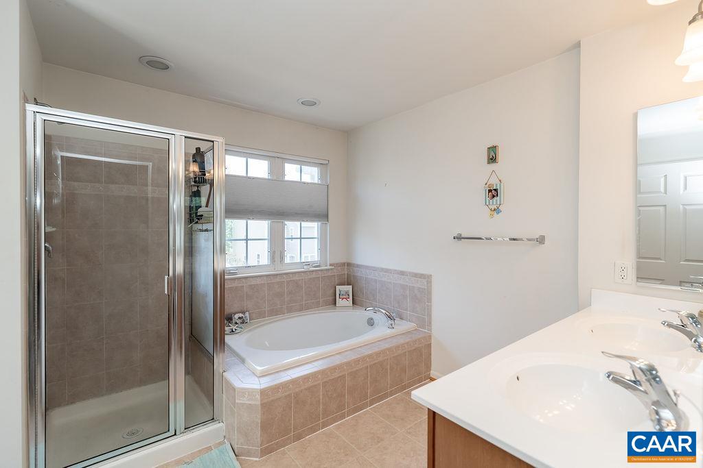 920 Bing Lane Charlottesville, VA 22903 - Photo 42 of 47 a bathroom with a tub a sink and a shower