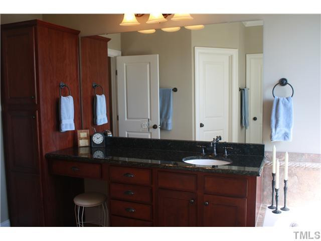 2812 Winter Song Road Raleigh, NC 27614 - Photo 19 of 24 This elegant master bath features a large walk-in closet, water closet, linen cabinet, and make-up vanity area. Oil rubbed bronze fixtures & hardware add elegance to this lovely bath. The whirlpool tub & separate shower are graced with tile surround. Master Bath/Spa