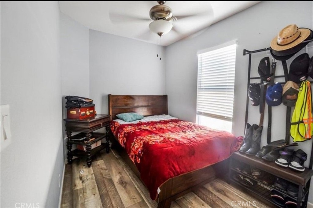 12700 Elliott El Monte, CA 91732 - Photo 12 of 18 a bedroom with a bed and a flat tv screen on the dresser