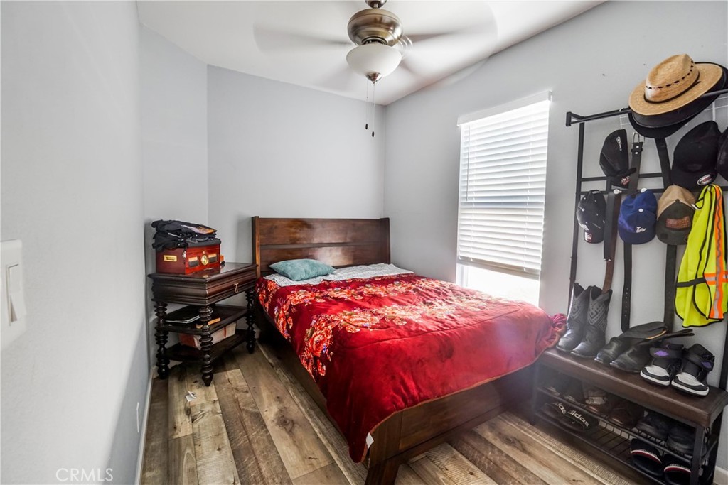12700 Elliott El Monte, CA 91732 - Photo 15 of 18 a bedroom with a bed and a flat tv screen on the dresser