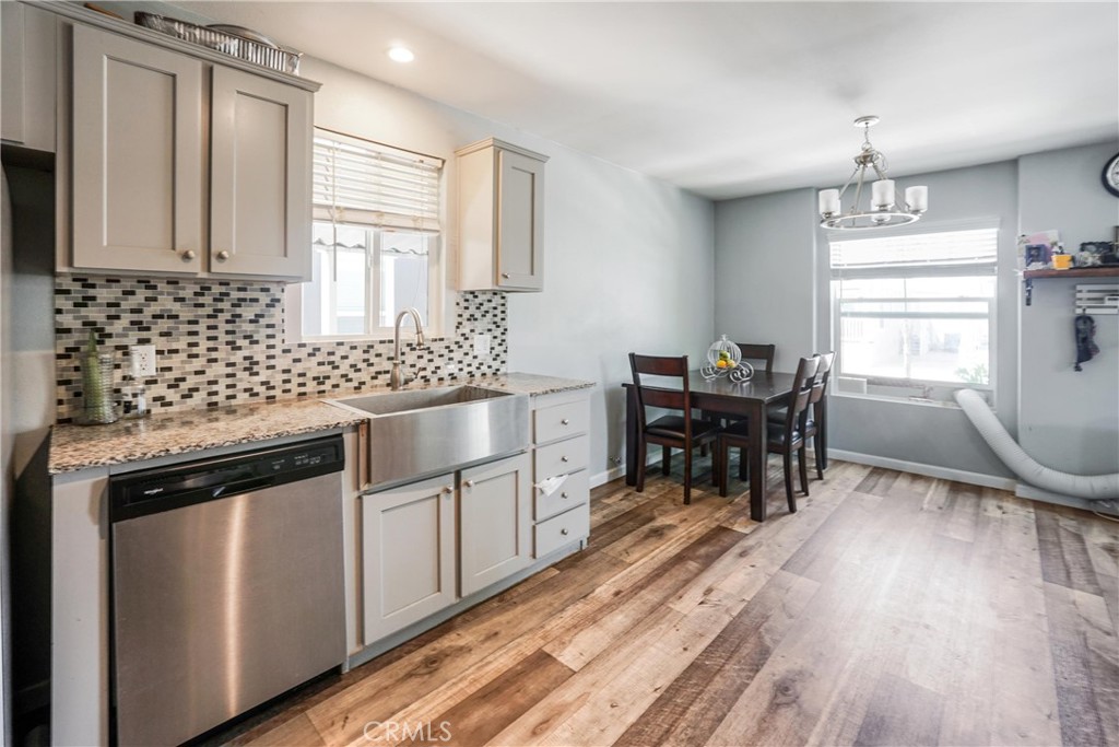 12700 Elliott El Monte, CA 91732 - Photo 4 of 18 a kitchen with stainless steel appliances granite countertop a stove a sink and a refrigerator