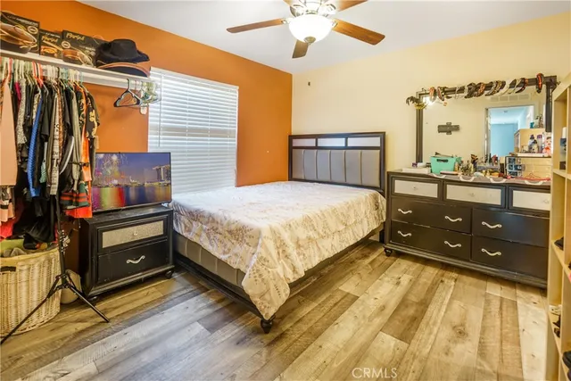a bedroom with a bed and cabinets